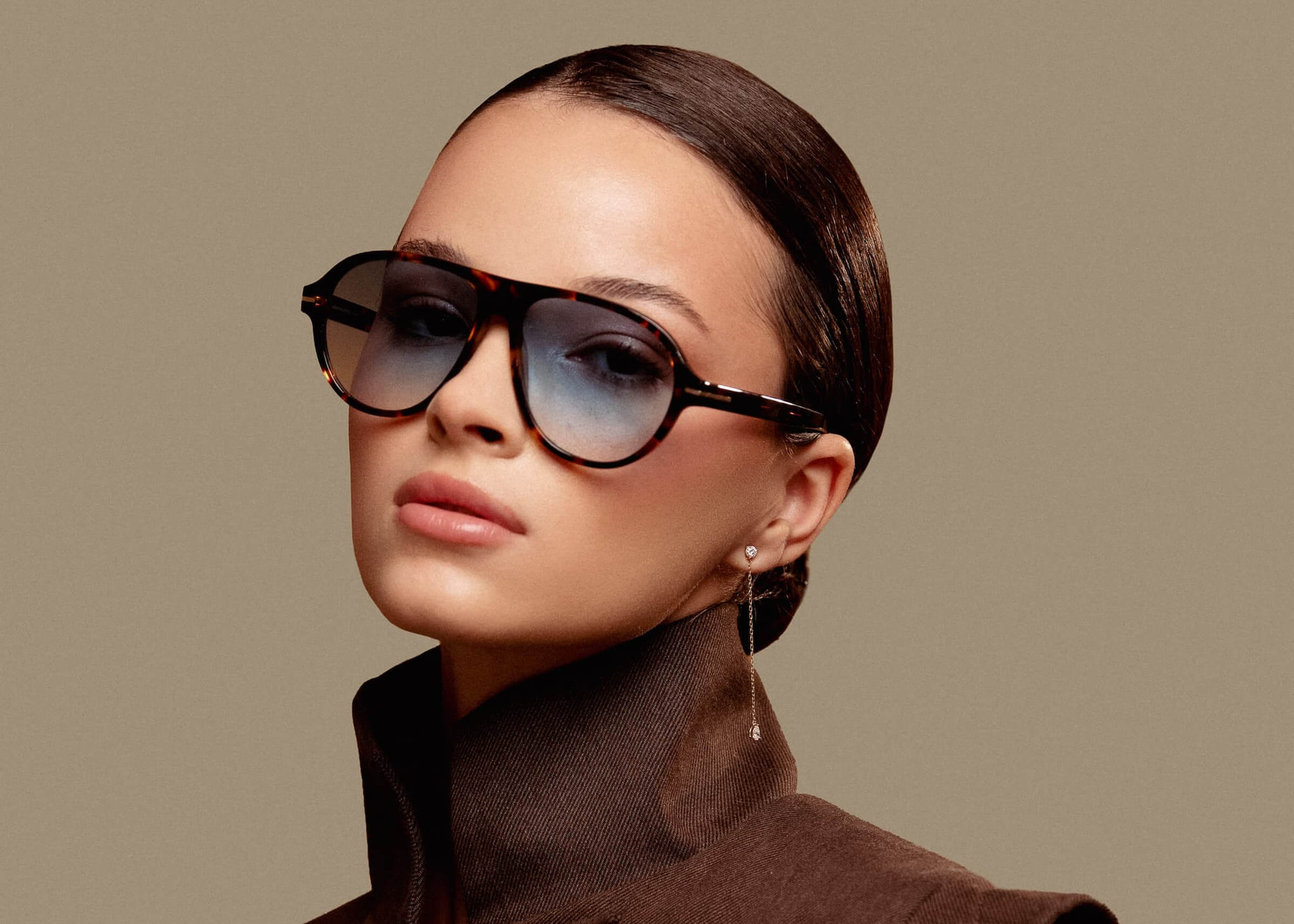 Connect with Anaté fine jewelry — model wearing the Nara pear diamond ear jacket earrings in solid yellow gold