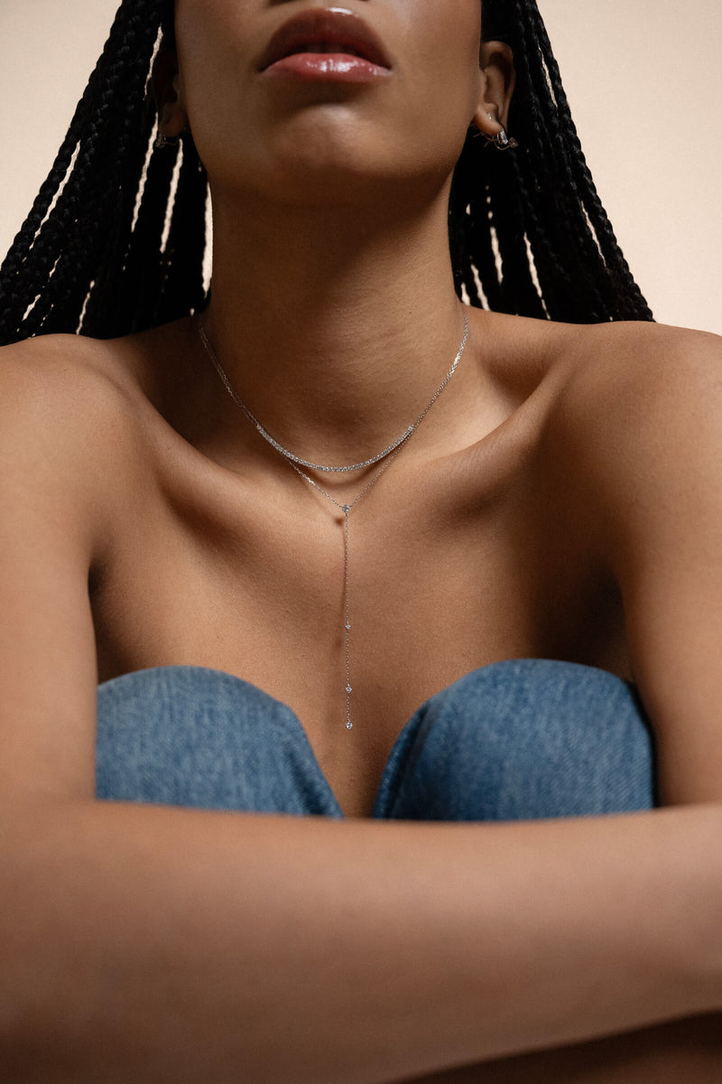 Anate Everyday Staples — model styling the Luna round diamond tie necklace in solid white gold with denim