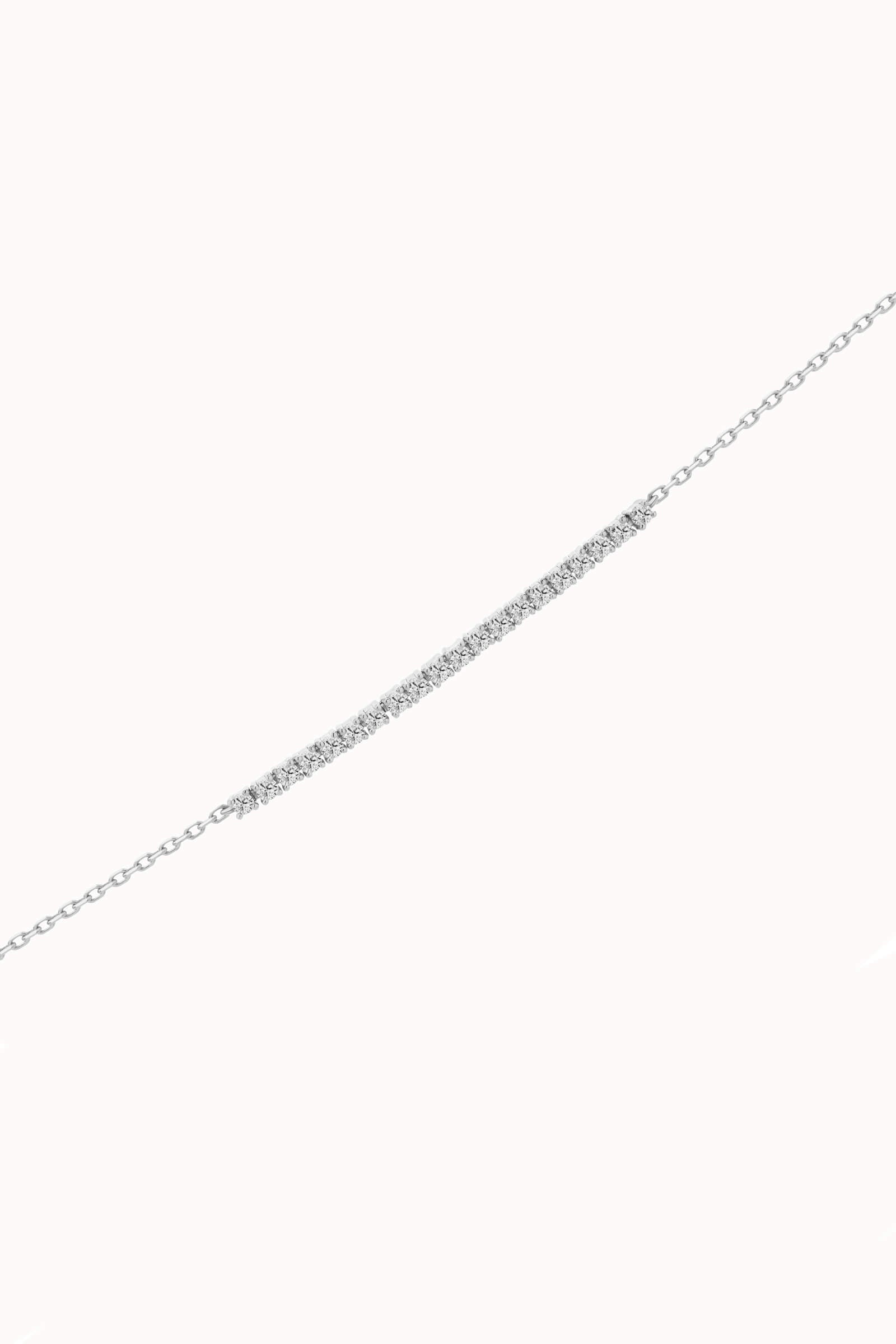 Aurea diamond smile bracelet in solid white gold by Anate, three-quarter angle view