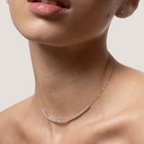 Model wearing the Solea diamond smile necklace in solid white gold by Anate, worn on neck