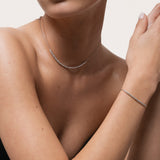 Model wearing the Solea diamond smile necklace in solid white gold by Anate, worn on neck
