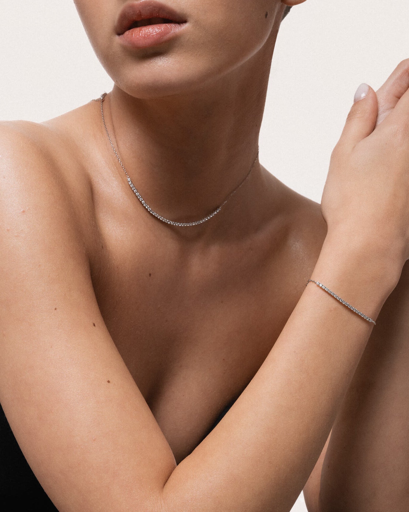 Model wearing the Solea diamond smile necklace in solid white gold by Anate, worn on neck