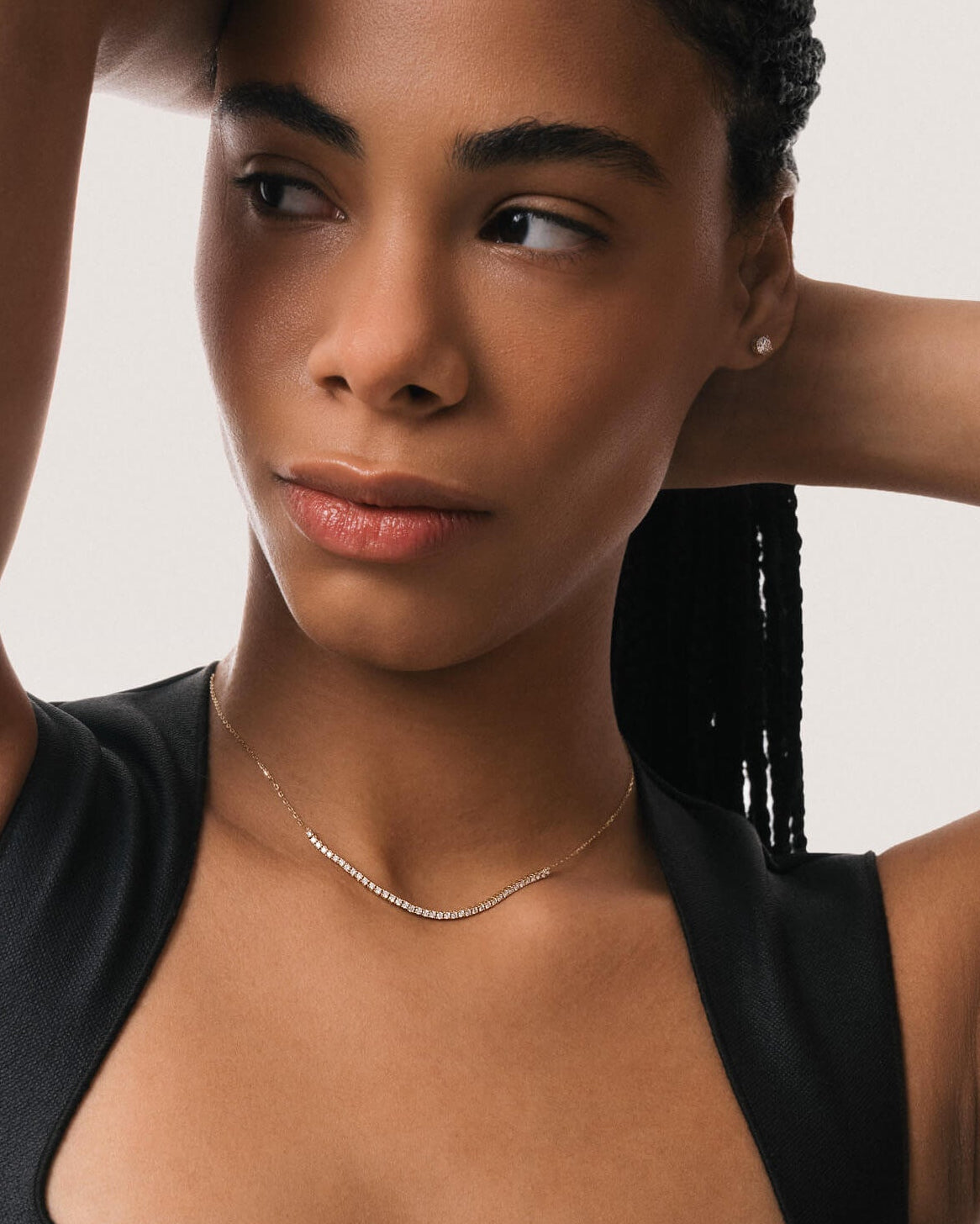 Model wearing the Solea diamond smile necklace in solid yellow gold by Anate, worn on model, close-up