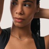 Model wearing the Solea diamond smile necklace in solid yellow gold by Anate, worn on model, close-up