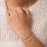 Model wearing the Mara heart diamond bracelet in solid white gold by Anate, worn on wrist