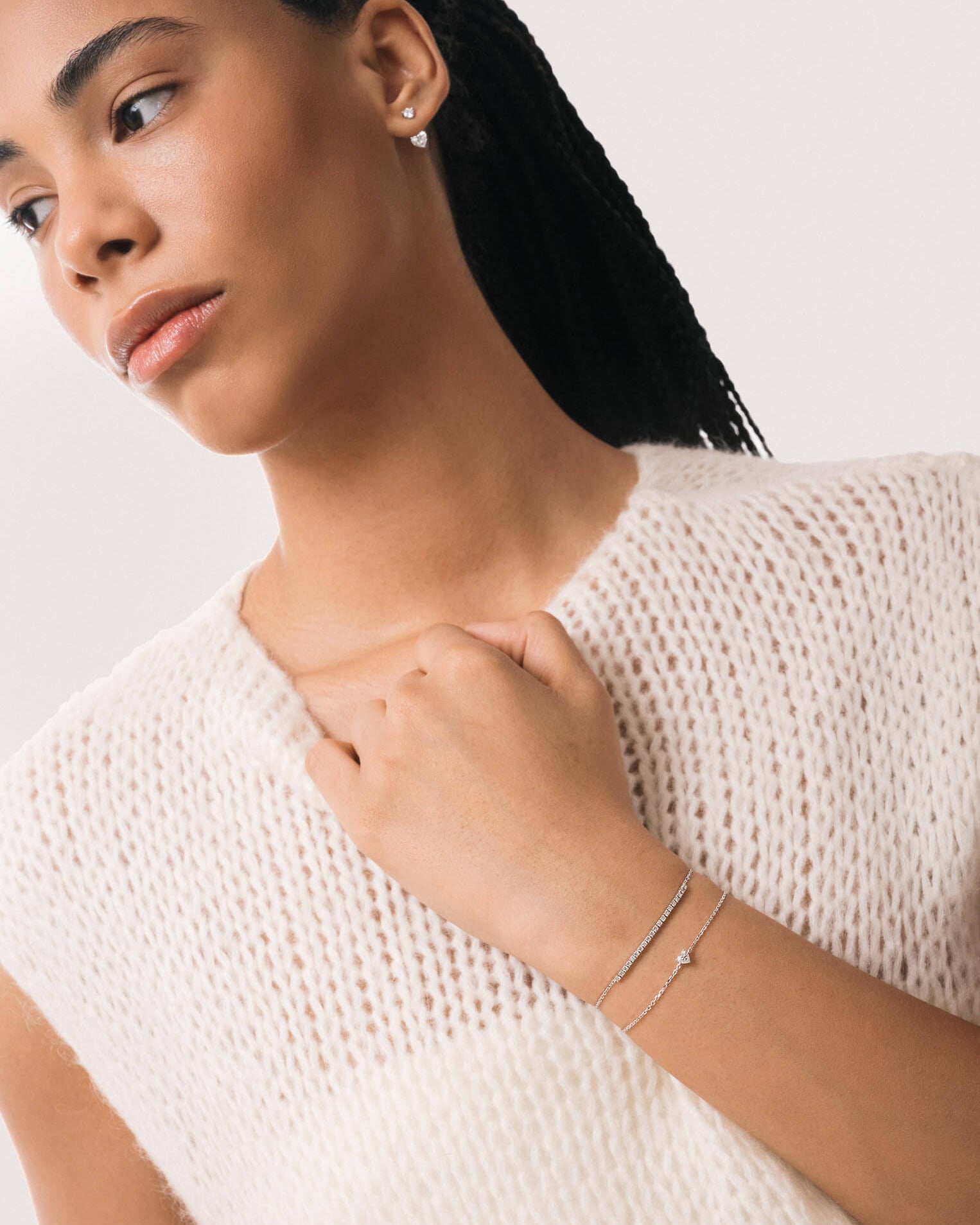 Model wearing the Mara heart diamond bracelet in solid white gold by Anate, worn on wrist