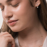 Model wearing the Nia heart diamond ear jacket earrings in solid yellow gold by Anate, worn on ear variant--0.50ct
