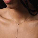 Model wearing the Amara heart diamond tie necklace in solid white gold by Anate, worn on model, close-up