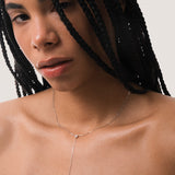 Model wearing the Amara heart diamond tie necklace in solid white gold by Anate, worn on model, portrait shot