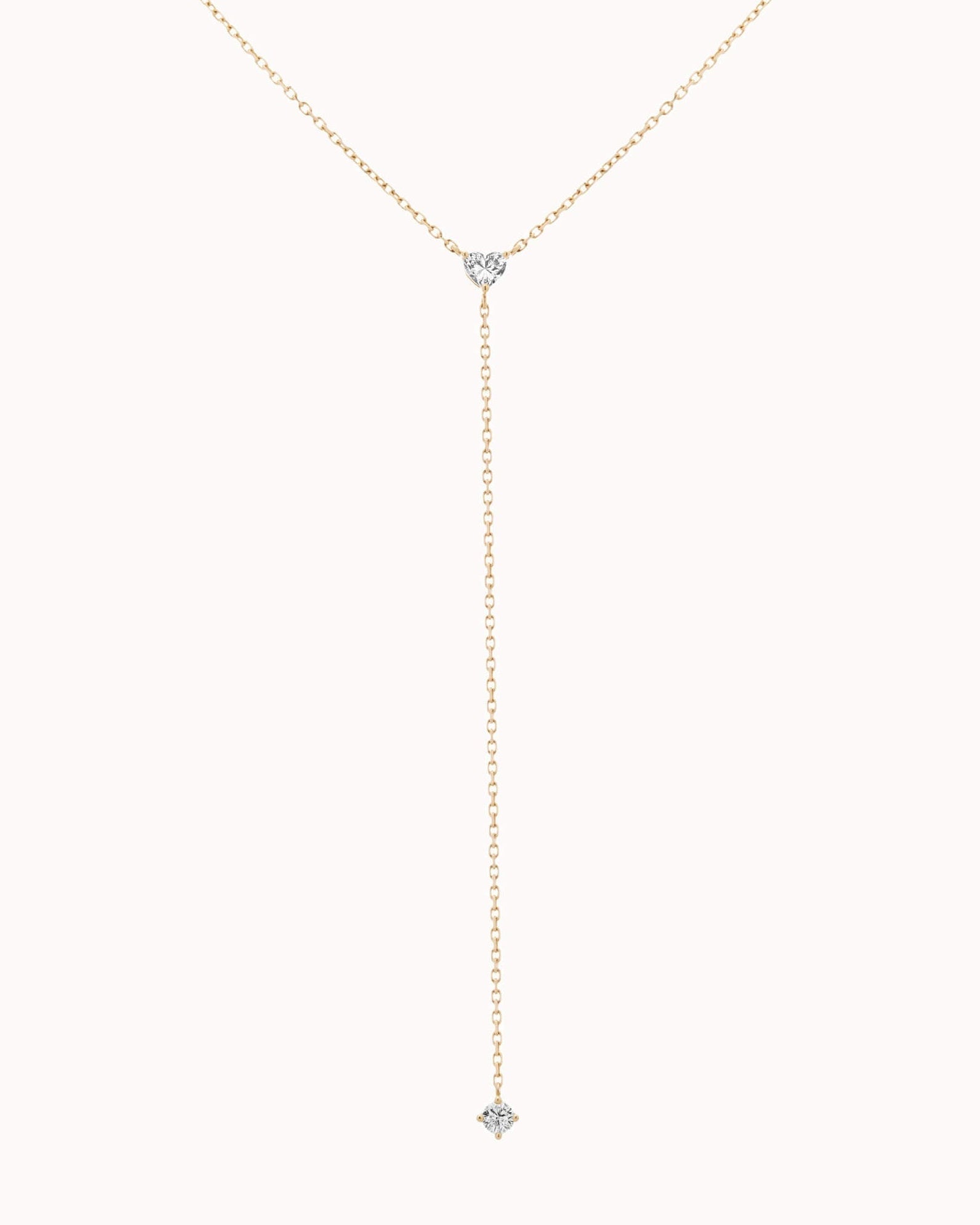 Amara heart diamond tie necklace in solid yellow gold by Anate, close-up of the pendant