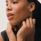 Model wearing the Elin oval diamond ear jacket earrings in solid white gold by Anate, worn on ear variant--0.25ct