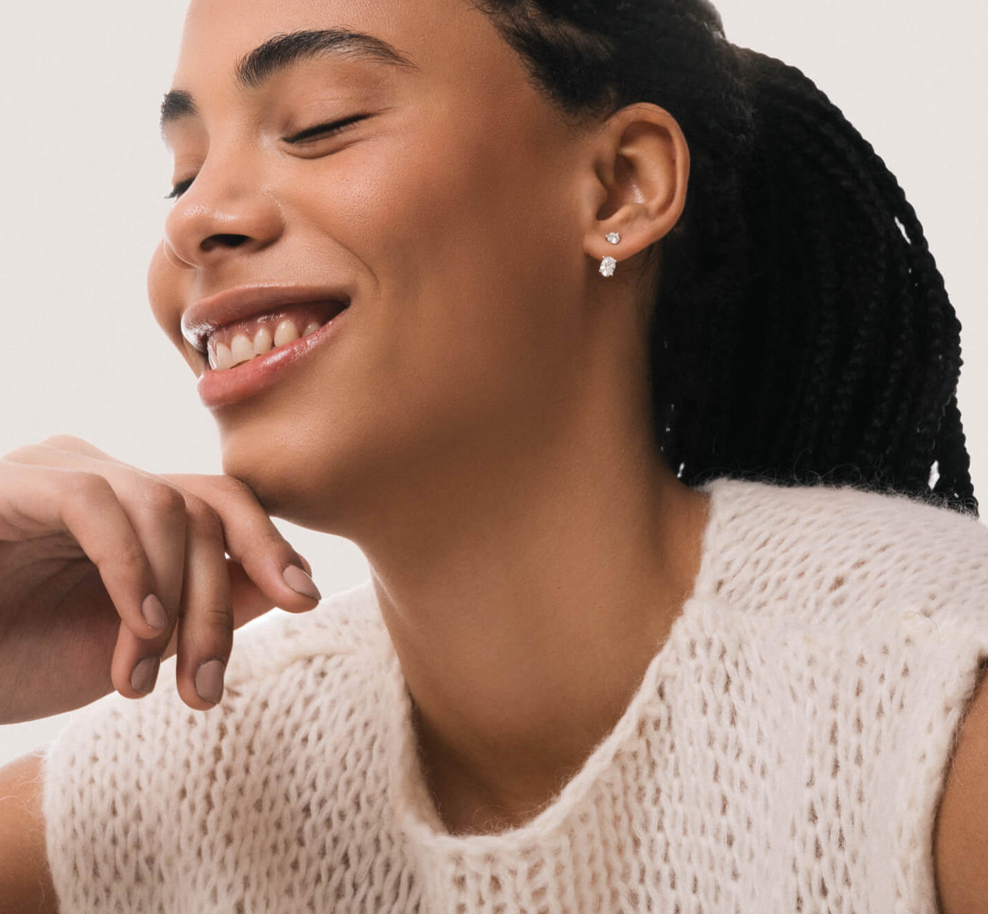 Model wearing the Elin oval diamond ear jacket earrings in solid white gold by Anate, worn on model, close-up variant--0.50ct testimonial image