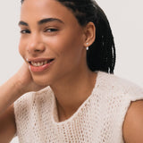 Model wearing the Elin oval diamond ear jacket earrings in solid white gold by Anate, worn on model, close-up variant--0.50ct