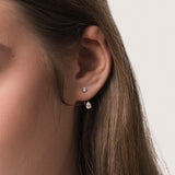 Model wearing the Nara pear diamond ear jacket earrings in solid yellow gold by Anate, worn on ear variant--0.25ct