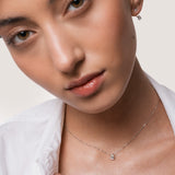 Model wearing the Liora pear diamond pendant in solid white gold by Anate, worn on model, portrait shot