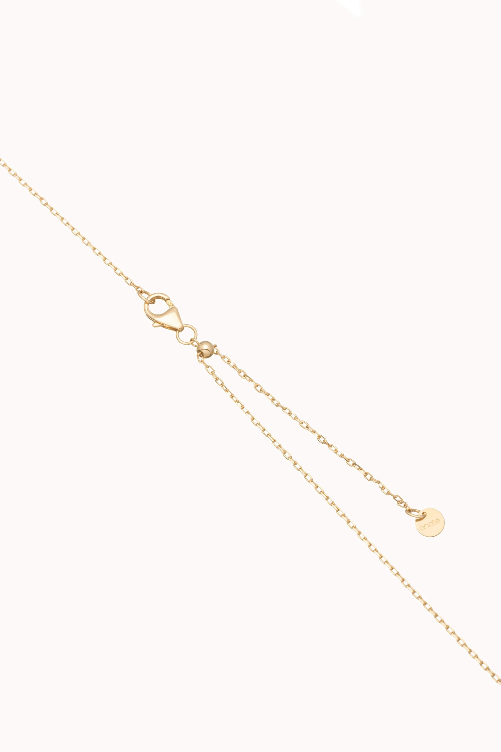 Kaia pear diamond tie necklace in solid yellow gold by Anate, close-up of the chain