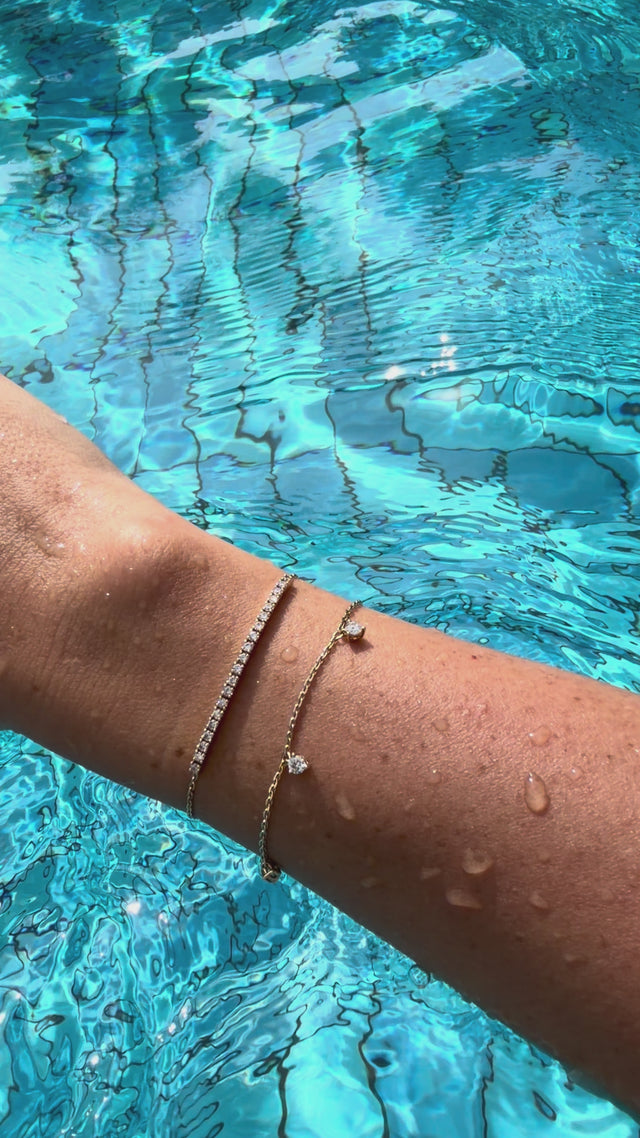 Smile bracelet yellow gold and 3 diamond bracelet by the pool