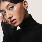 Model wearing the Astra round diamond stud earrings in solid white gold by Anate, worn on ear