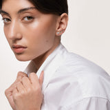 Model wearing the Astra round diamond stud earrings in solid yellow gold by Anate, worn on model, side profile