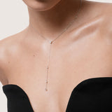 Model wearing the Luna round diamond tie necklace in solid white gold by Anate, worn on neck