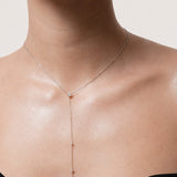 Model wearing the Luna round diamond tie necklace in solid white gold by Anate, worn on neck