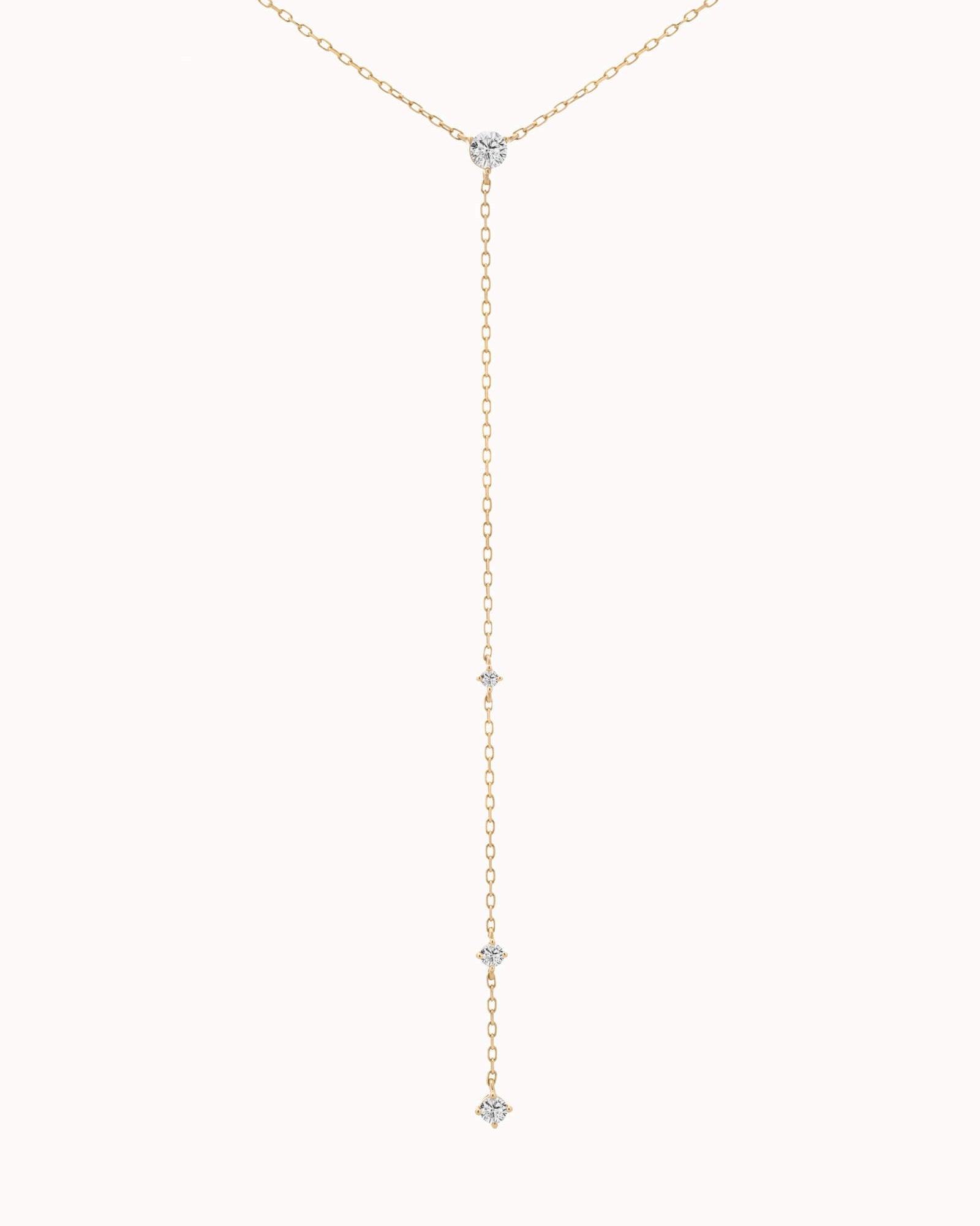 Luna round diamond tie necklace in solid yellow gold by Anate, close-up of the pendant