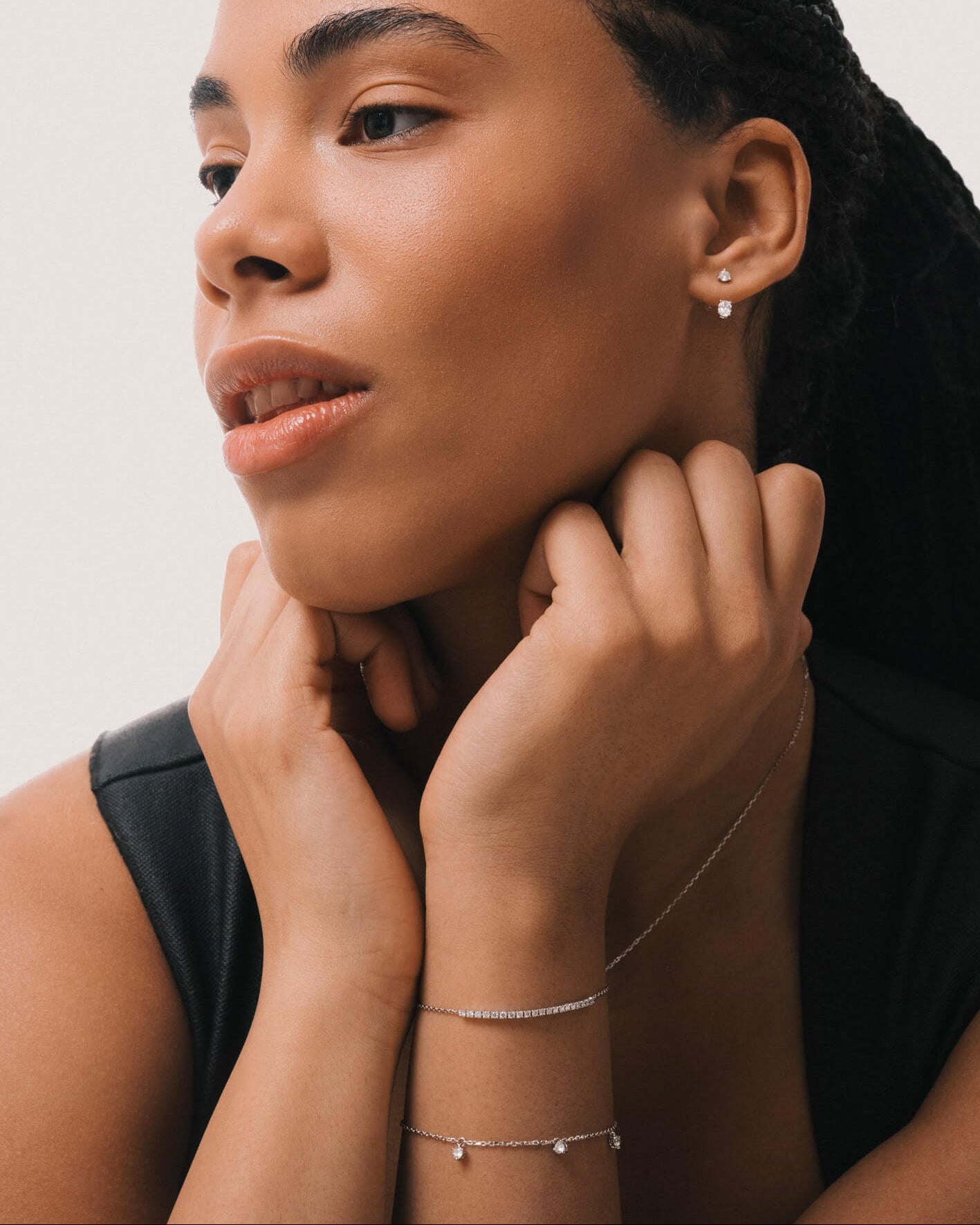 Model wearing the Tria three diamond bracelet in solid white gold by Anate, worn on wrist