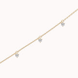 Tria three diamond bracelet in solid yellow gold by Anate, three-quarter angle view