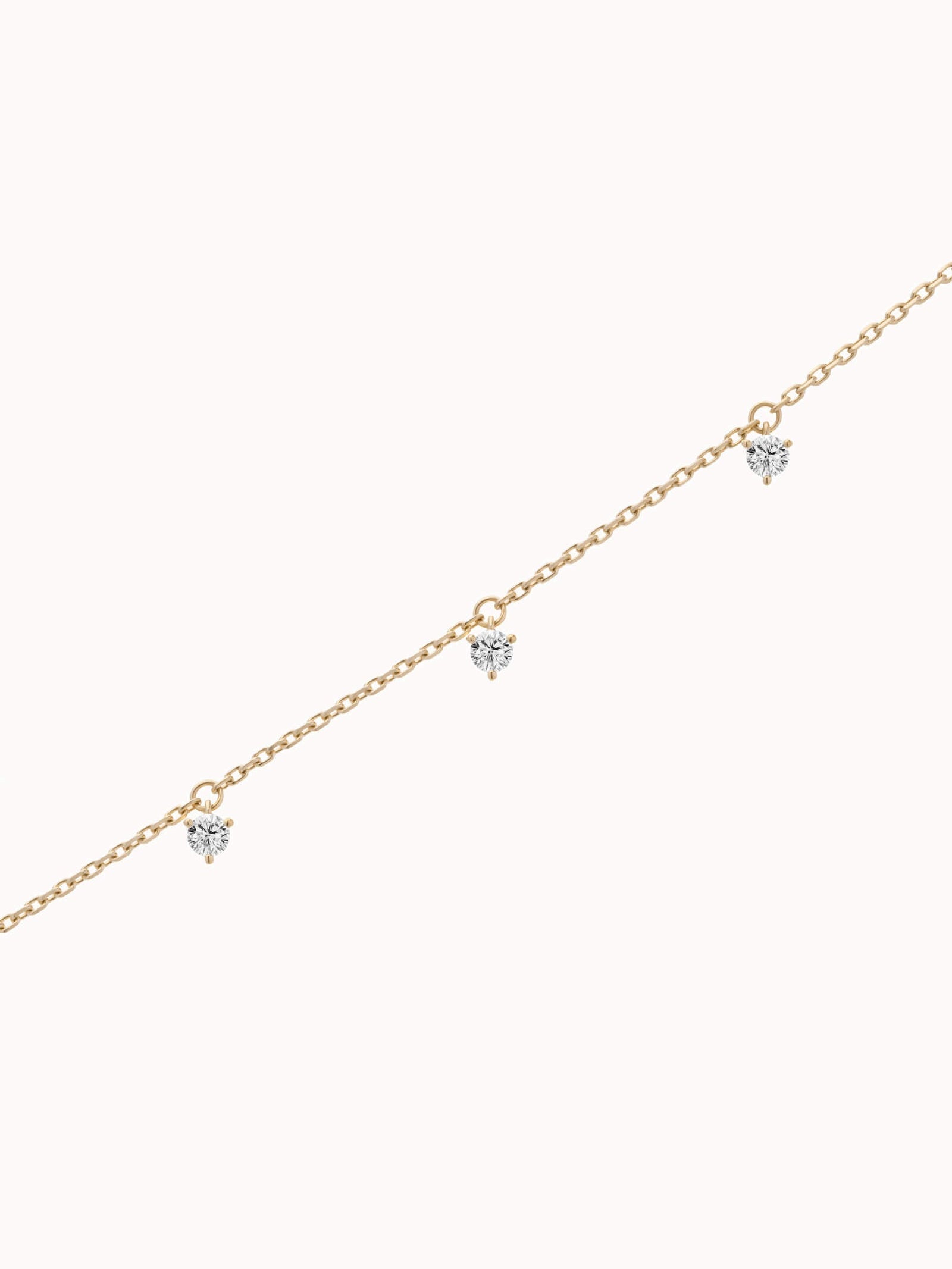 Tria three diamond bracelet in solid yellow gold by Anate, three-quarter angle view